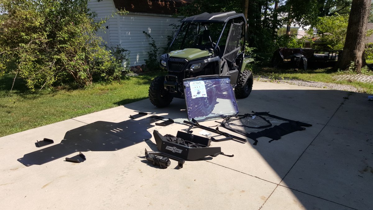 Had all accessories waiting before I bought it.  Popped on the Honda hard roof as it was already assembled.